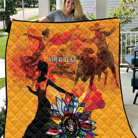 Gold personalized quilt with red dancing silhouette and colorful flower emblem, quilted texture.