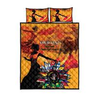 Gold quilt bed set with two pillows and quilt featuring a star floral motif