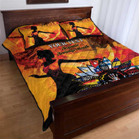 Gold quilt bed set on a wooden bed; dancer silhouettes with star floral artwork