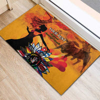 Personalized rubber doormat with gold scene, black silhouette figures, and ornate floral centerpiece