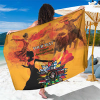 Personalized gold sarong with large multicolor sun-and-figure graphic and custom text panel