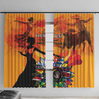 Gold curtain pair with centered silhouette and colorful floral emblem; top rings visible.
