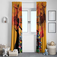 Gold double window curtains with silhouette figures and colorful flower emblem at the bottom.