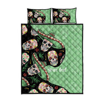 Quilt bed set flat view: green quilt with black sugar skull pattern and 2 pillows