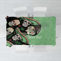 Green tablecloth with black sugar skull artwork and 'Your text' in center