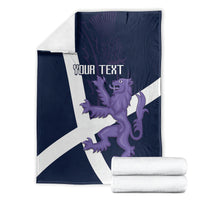 Folded navy rugby blanket with white cross, purple lion graphic and customizable text