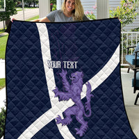 Navy quilt with white diagonal cross, purple lion graphic, and centered text panel
