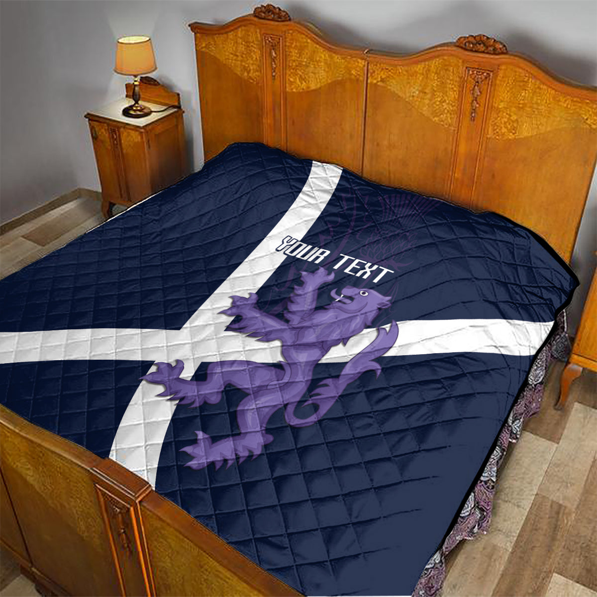 Navy bed quilt featuring white diagonal cross and purple lion graphic with “YOUR TEXT”
