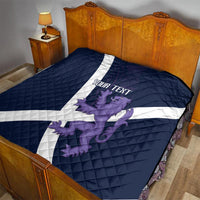 Navy bed quilt featuring white diagonal cross and purple lion graphic with “YOUR TEXT”