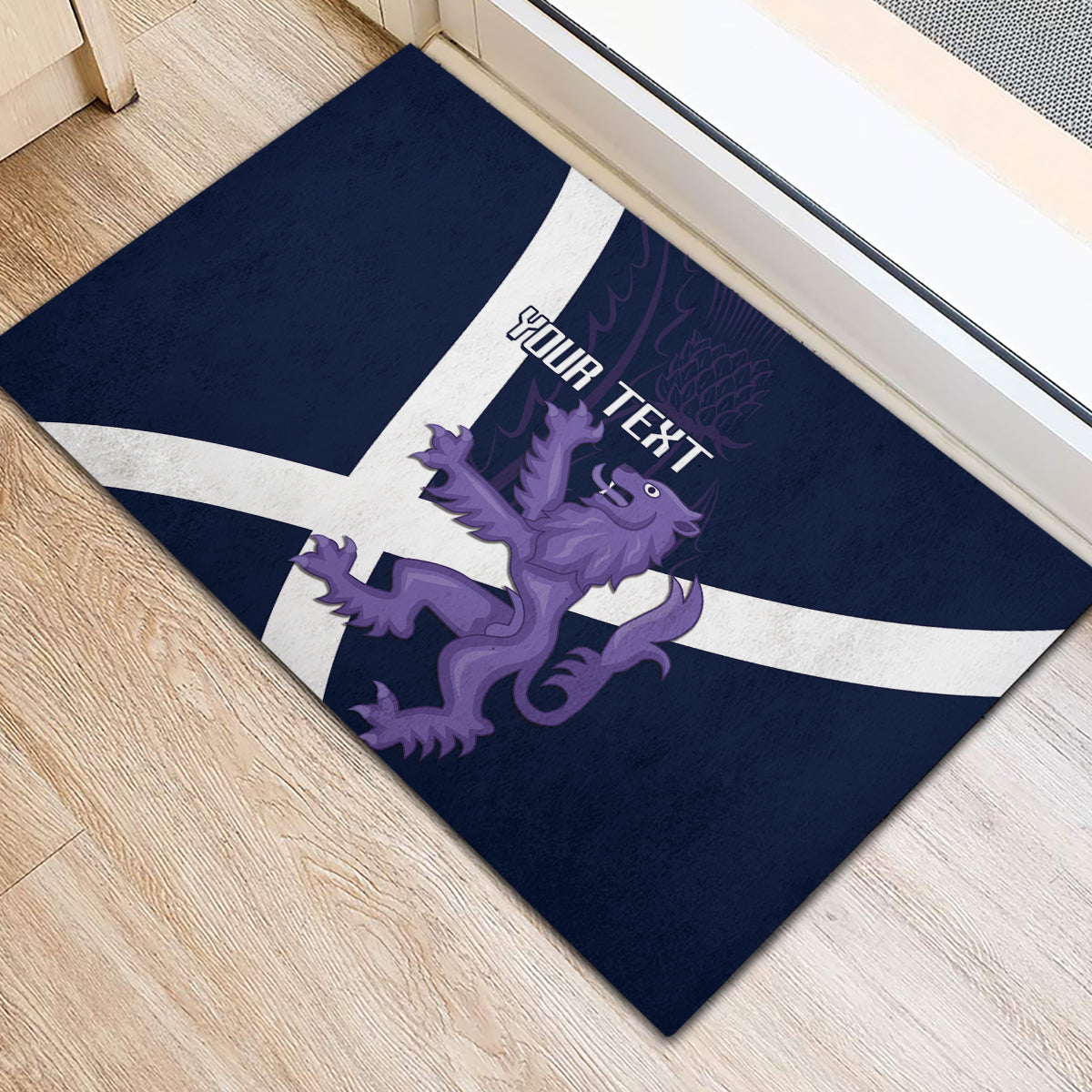 Navy rugby-style doormat with white St. Andrew's cross and purple lion with custom text