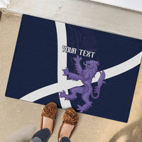 Navy rugby-style doormat with white cross, purple lion, and 'YOUR TEXT' under shoes