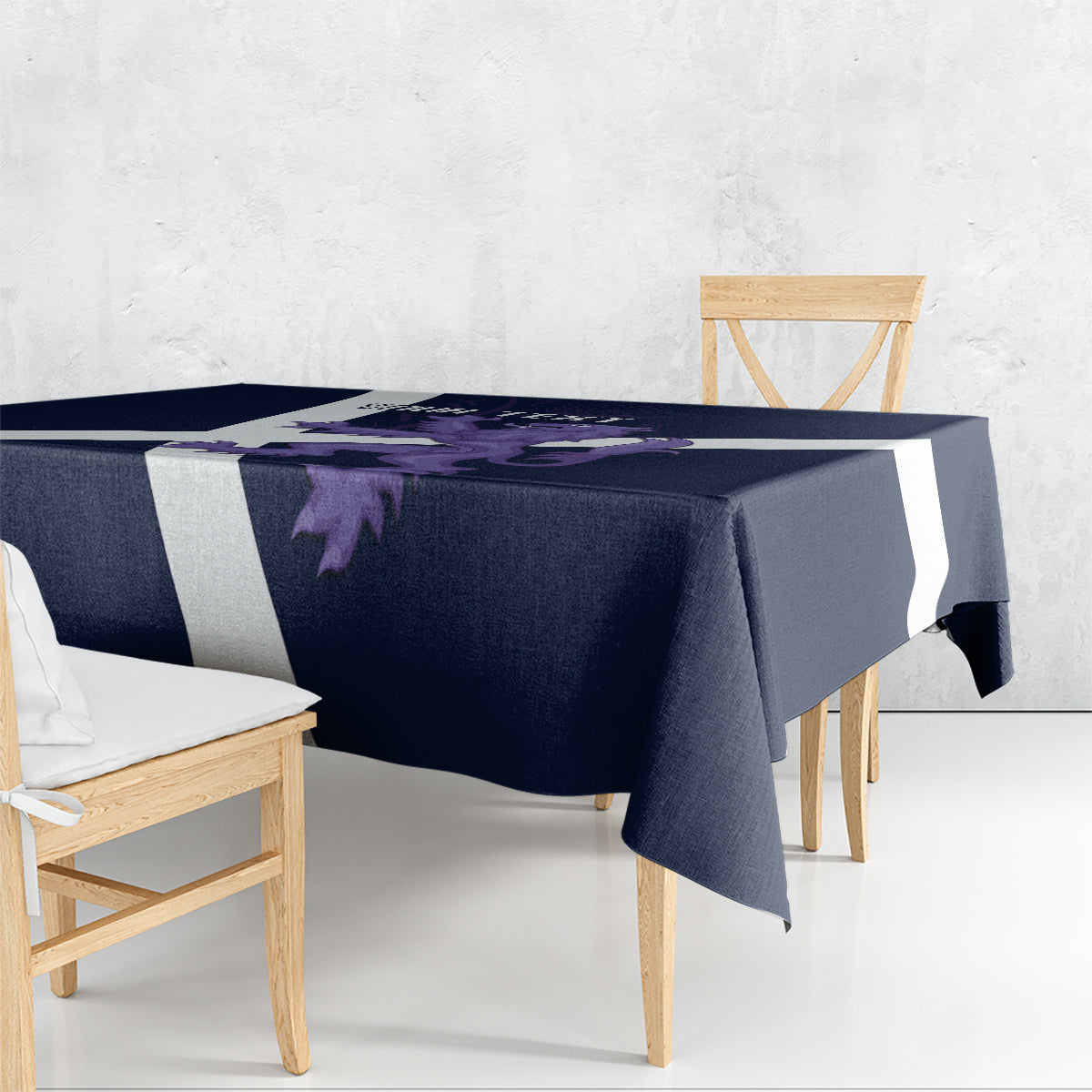 Navy rectangular tablecloth with white stripes and purple lion artwork, draped over table