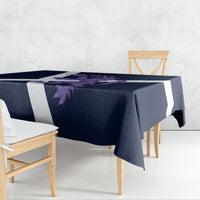 Navy rectangular tablecloth with white stripes and purple lion artwork, draped over table