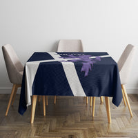 Navy tablecloth with white stripe runner and purple lion motif, square table view