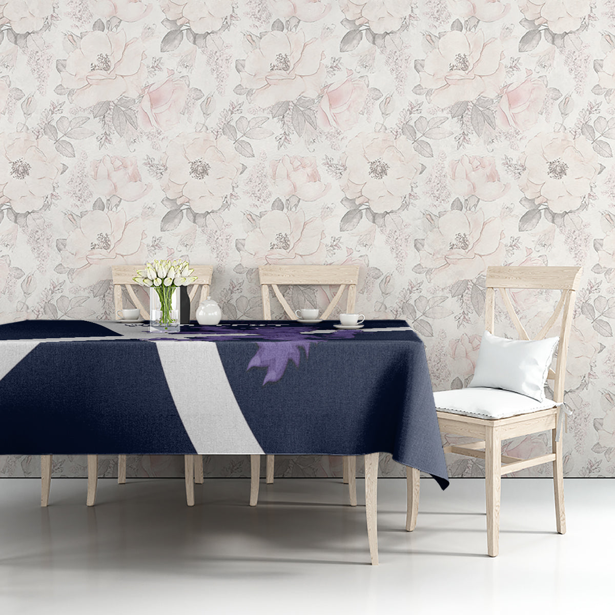Navy tablecloth with white diagonal stripe and purple lion emblem, laid over dining table