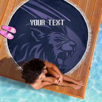 Round navy beach blanket with fringe, lion graphic and 'YOUR TEXT' on dark center