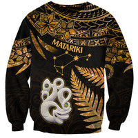 Unisex gold and black Maori sweatshirt with Matariki stars and manaia face graphic