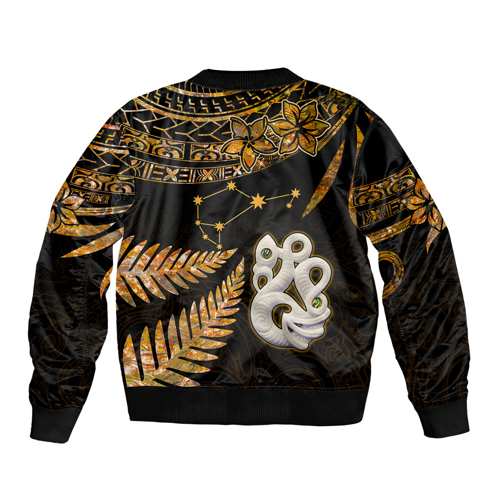 Bomber jacket with gold fern and star motifs, black body, ribbed hem, back emblem graphic