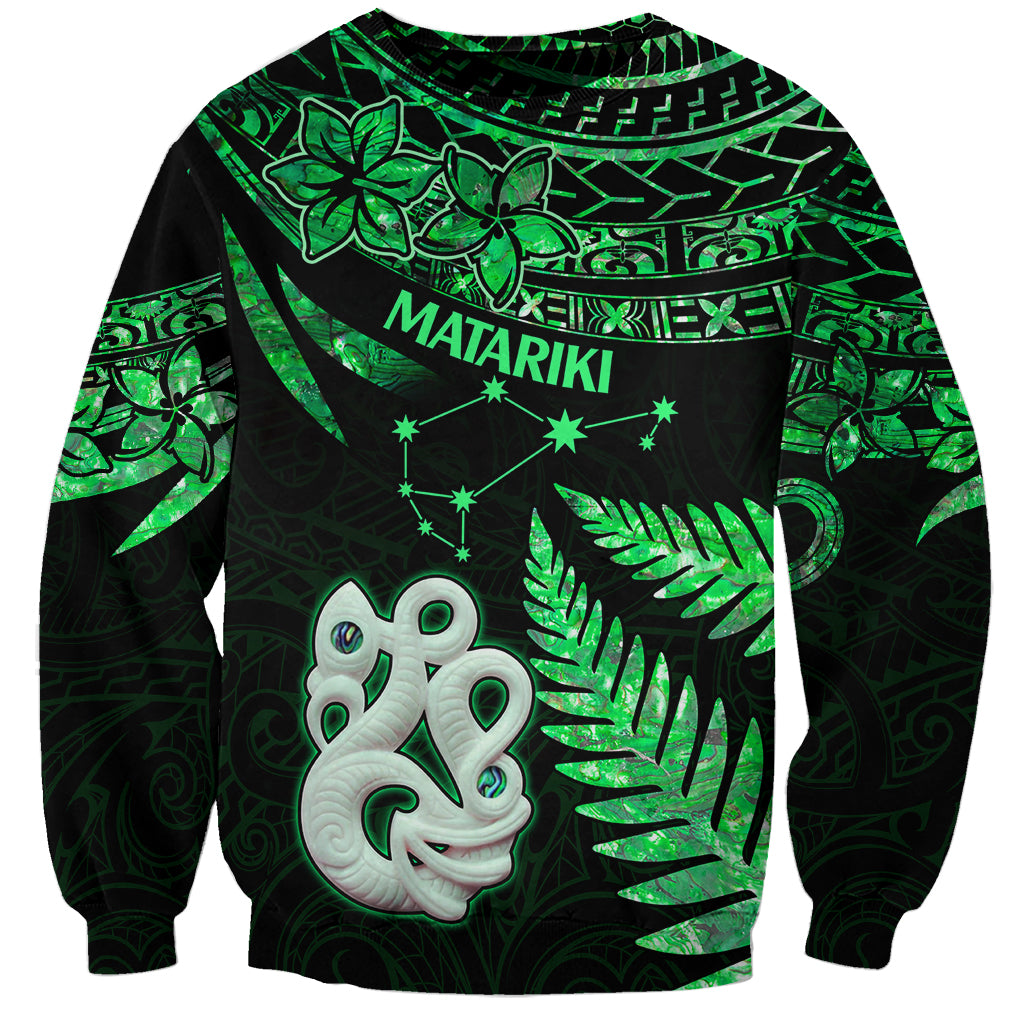 Unisex green sweatshirt with black base, Maori star and manaia graphic with leaf details