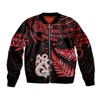 Unisex bomber jacket in red and black with full-zip and red manaia graphic