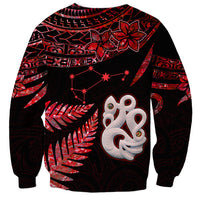 Unisex red-and-black sweatshirt with large white manaia mask graphic