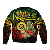 Black bomber jacket back view with green/yellow/red island pattern and flower art