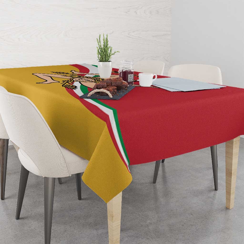 Red and yellow tablecloth with Sicilian flag-style emblem, set on a dining table