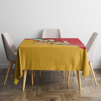 Rectangular tablecloth with red top edge and yellow body, featuring Sicilian emblem
