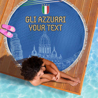 Round blue beach blanket with fringed edge on striped mat, 'GLI AZZURRI YOUR TEXT' graphic.