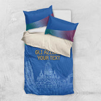 Blue duvet cover and two pillows with “GLI AZZURRI YOUR TEXT” and skyline print