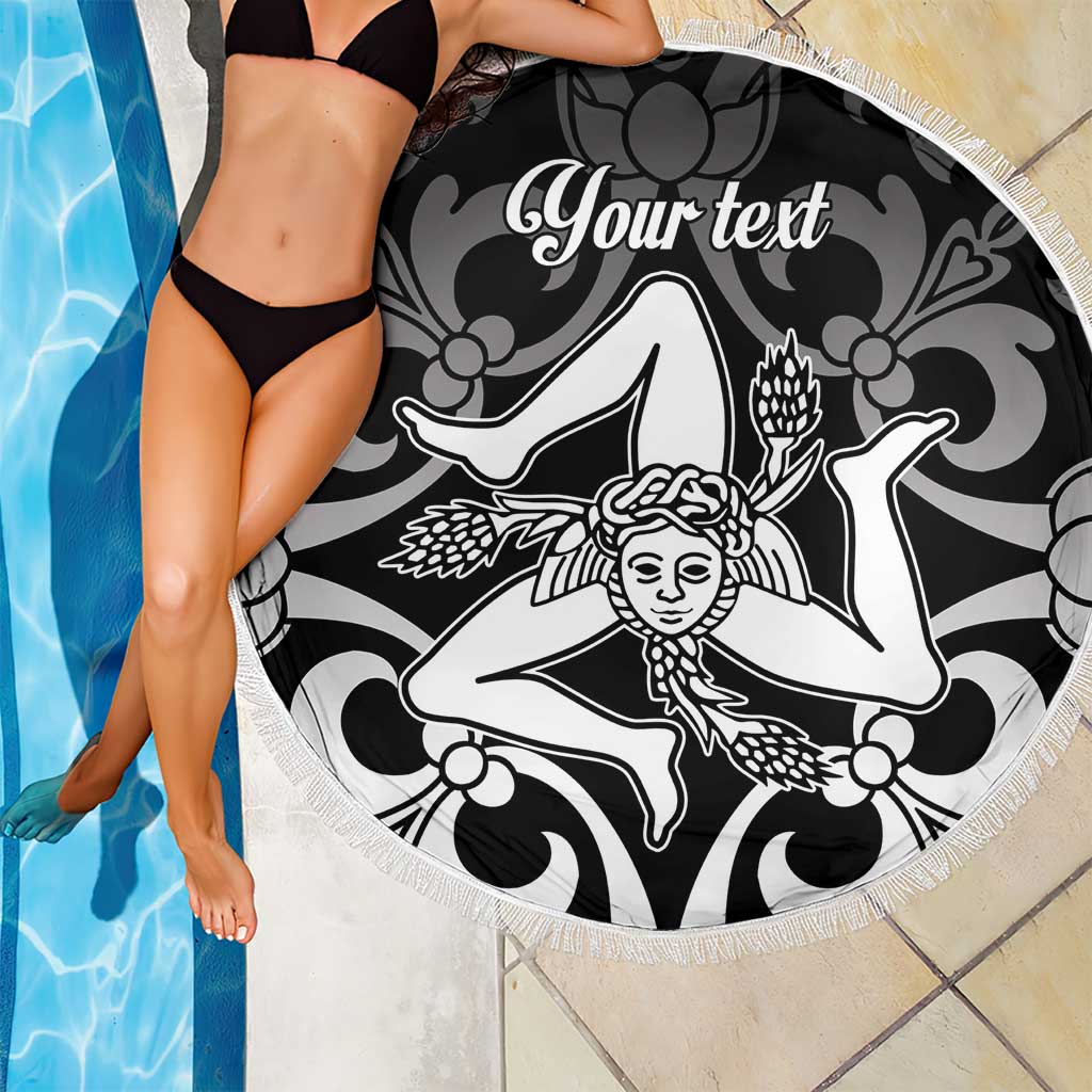 Round black beach blanket with white fringe, face motif graphic, and custom text