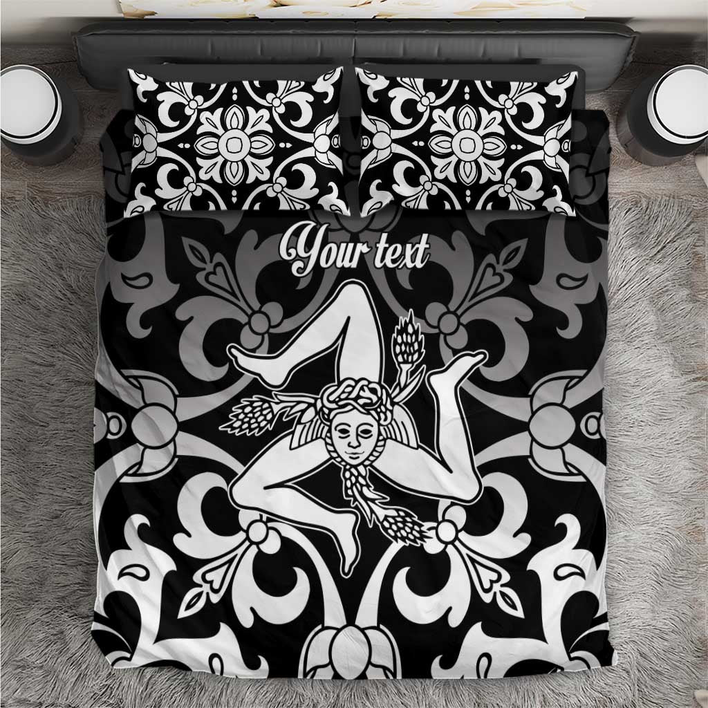Black and white bedding set close-up showing baroque angel motif on duvet and pillowcases