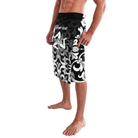 Side-view knee-length black swim shorts with white floral print and 'Your text' area
