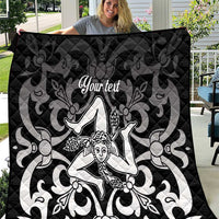 Black quilt blanket with gray pattern and central Trinacria-style woman graphic, 'Your text'.