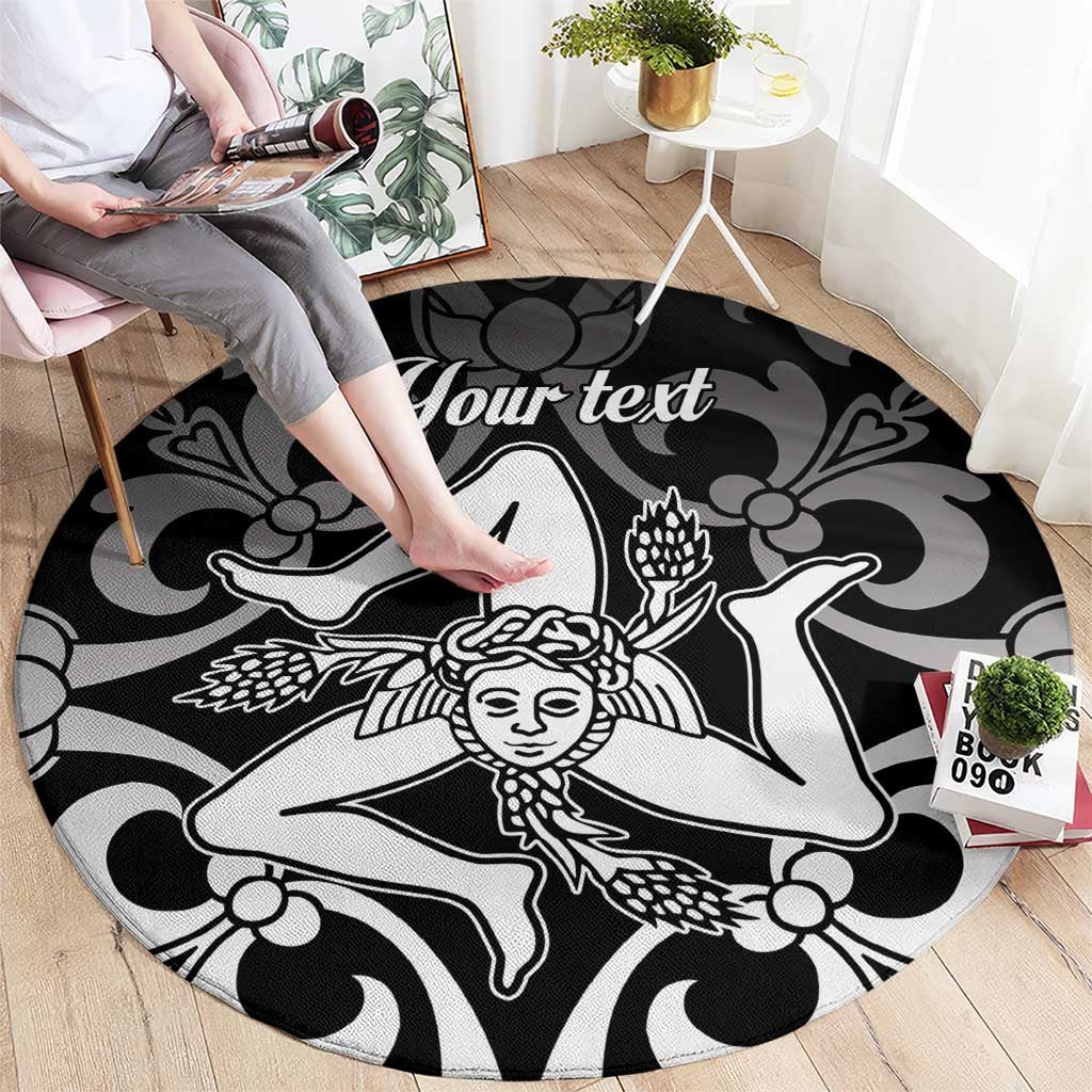 Black round carpet with white custom text and dancer motif, shown with shoes nearby