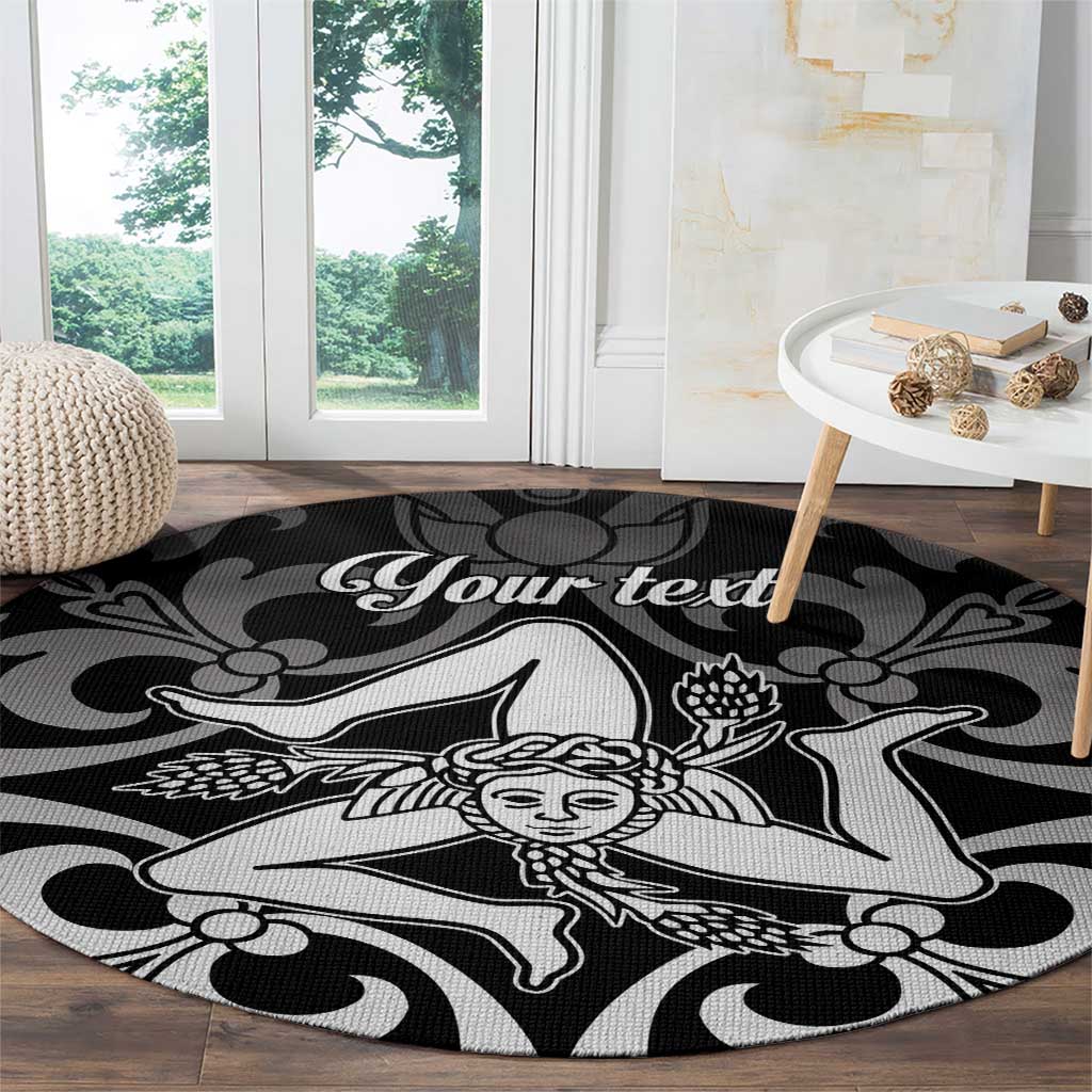 Black round carpet with white custom text and central dancer motif in living room