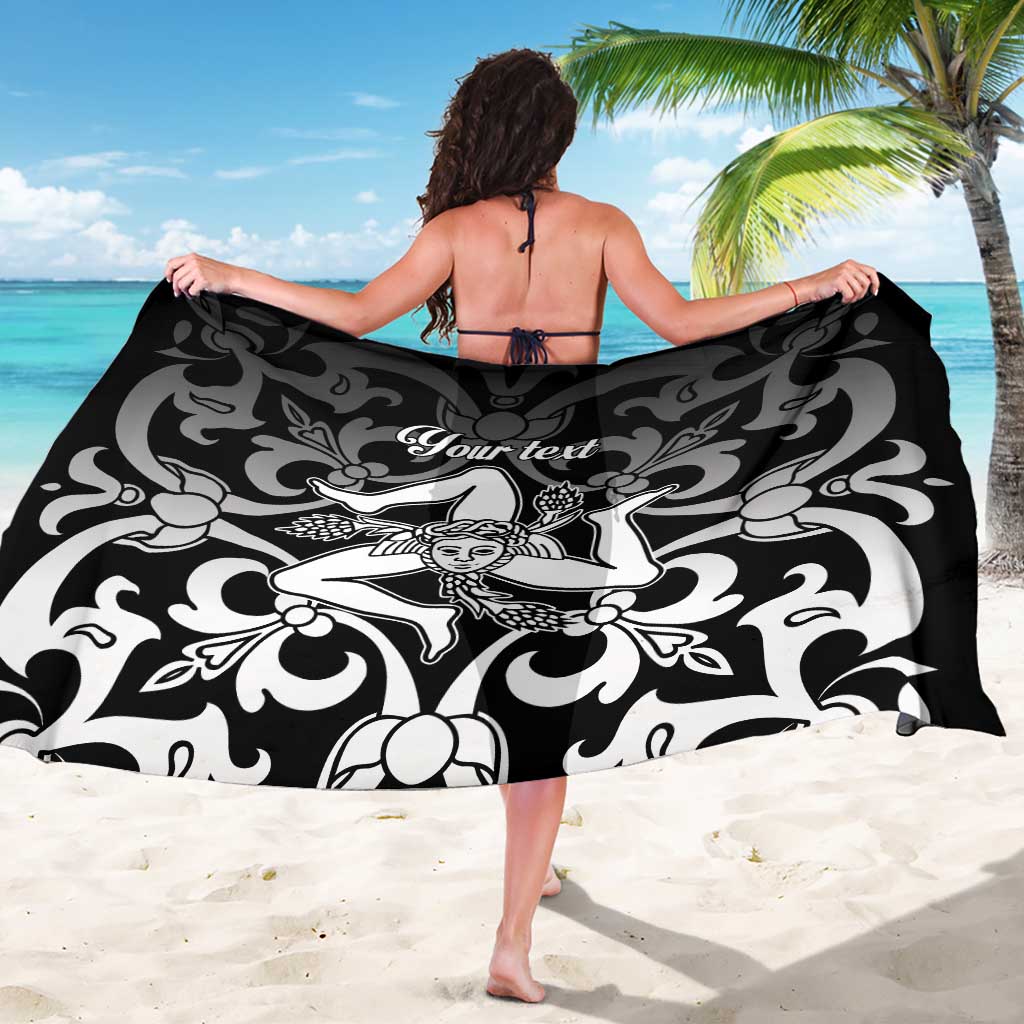 Black and white floral personalized sarong with central figure motif, worn as wrap