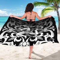 Black and white floral personalized sarong with central figure motif, worn as wrap