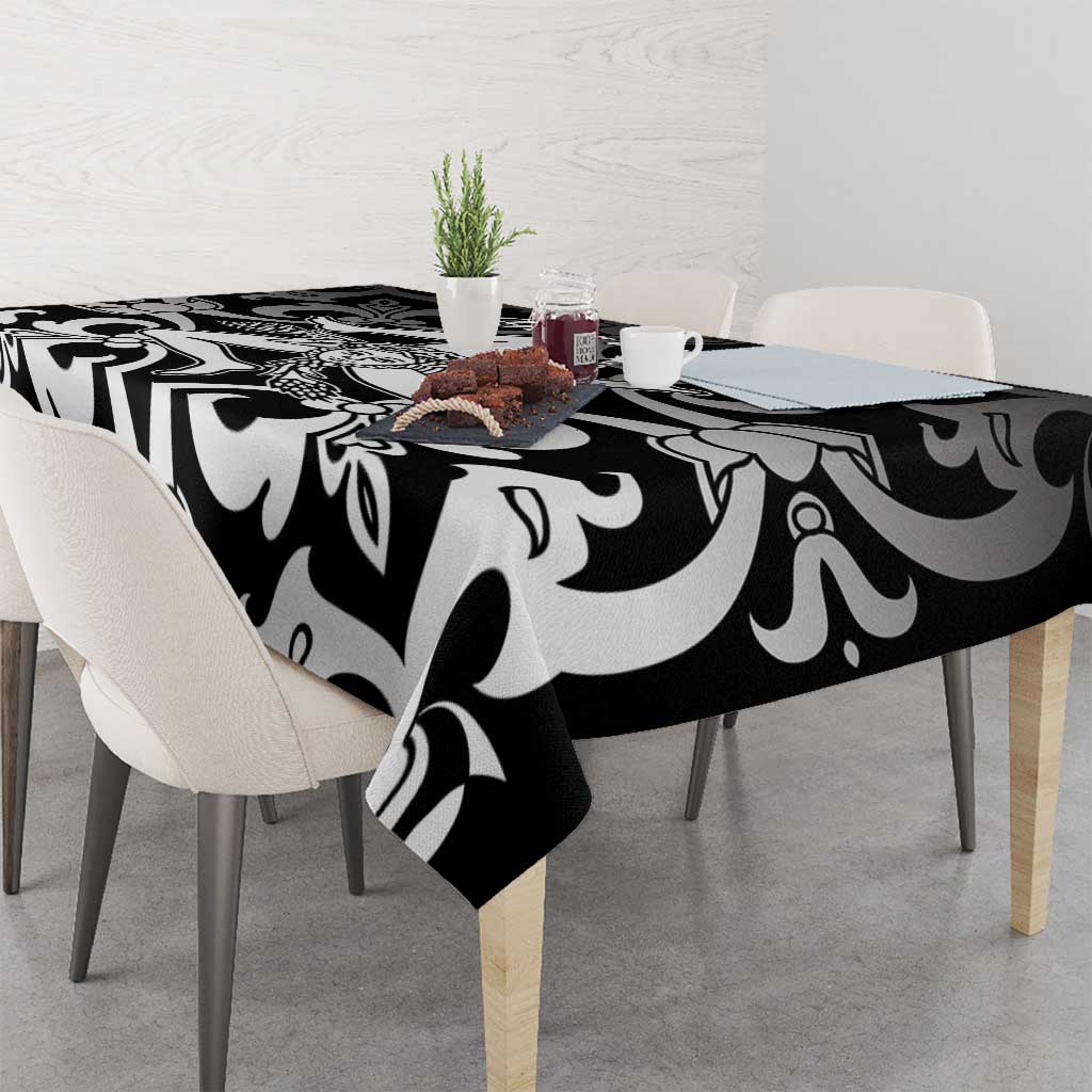 Black and white abstract floral tablecloth on a dining table
