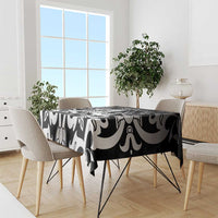 Black and white abstract tablecloth draped over a dining table