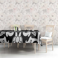 Black and white abstract floral tablecloth on a dining table