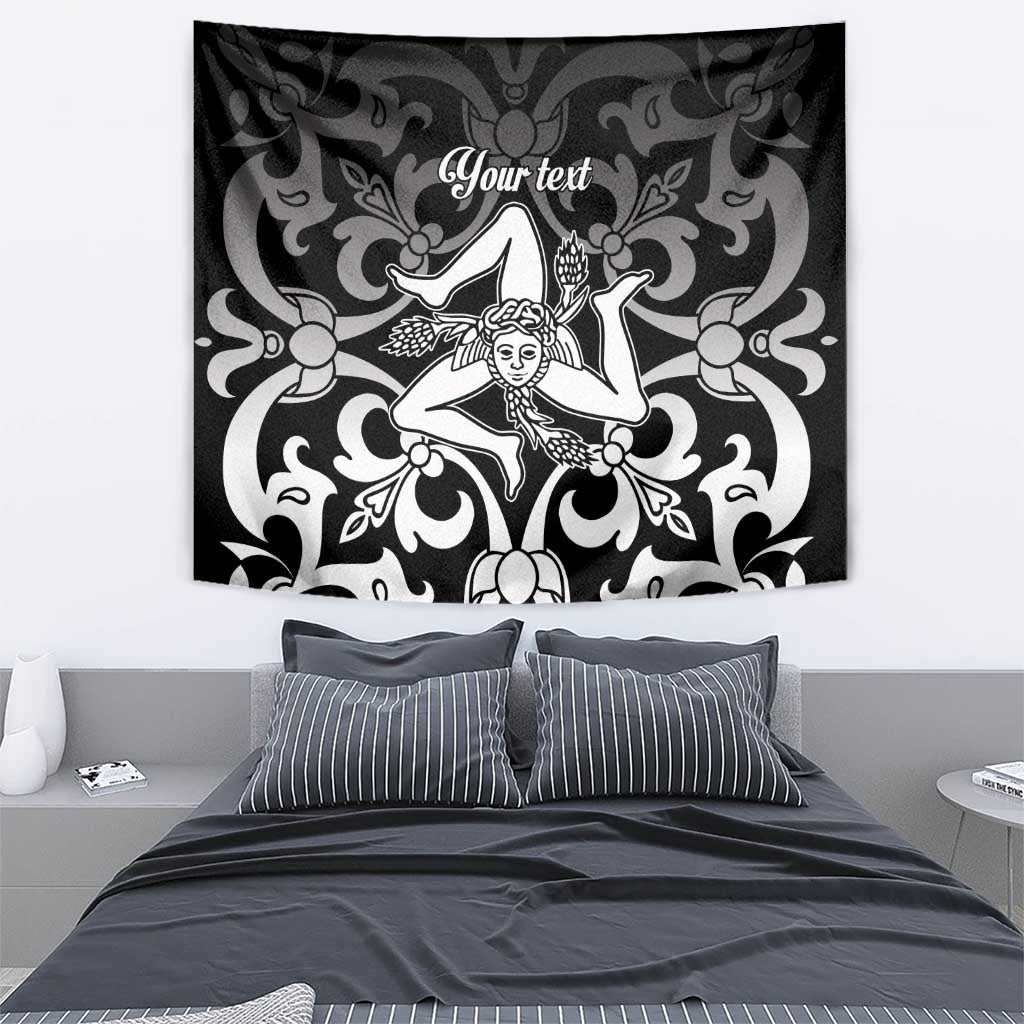 Black and white tapestry featuring central woman figure in baroque swirl design