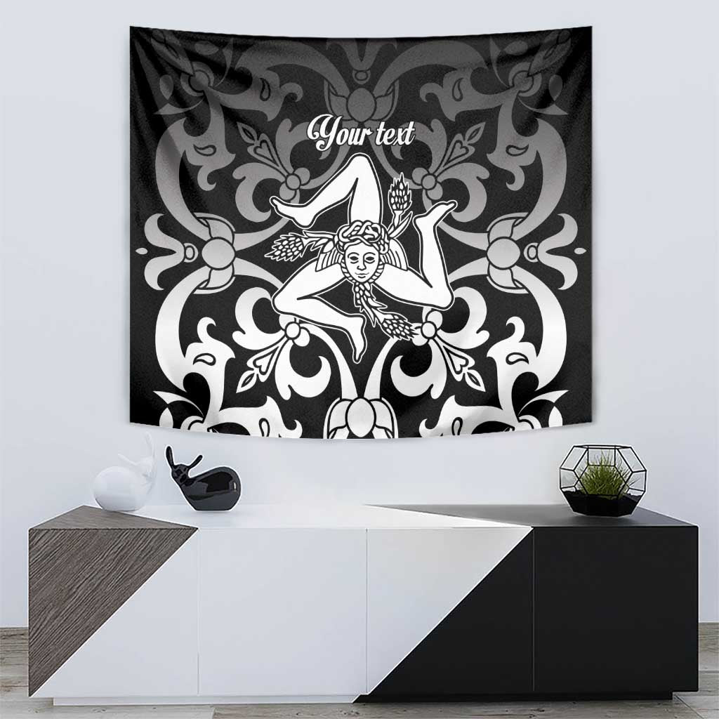 Black and white tapestry with central woman figure and decorative swirling vines