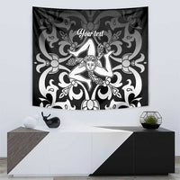Black and white tapestry with central woman figure and decorative swirling vines