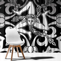 Black and white ornamental window curtain close-up with crown and figure graphic