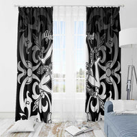 Black and white ornamental window curtains with printed motifs and tie-back look