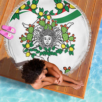 Round white beach blanket with cactus and lemon triskelion graphic, fringed border