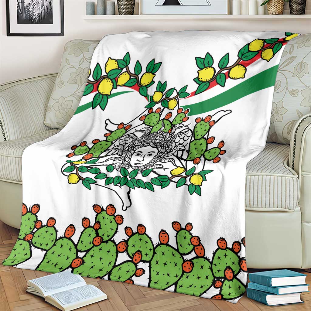 White blanket featuring central woman face with cactus and lemons, green diagonal stripe detail.