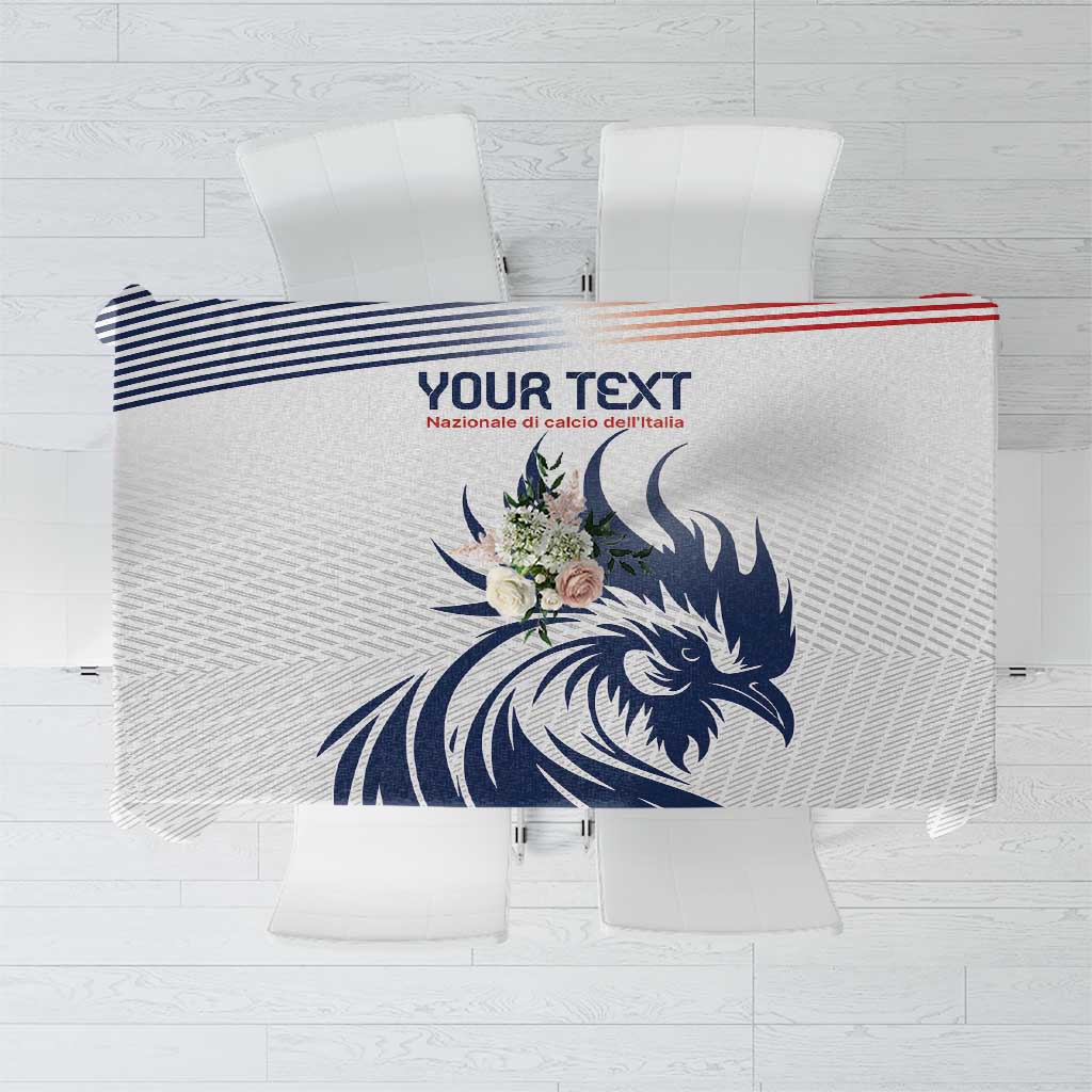 White tablecloth with blue rooster graphic and blue striped border