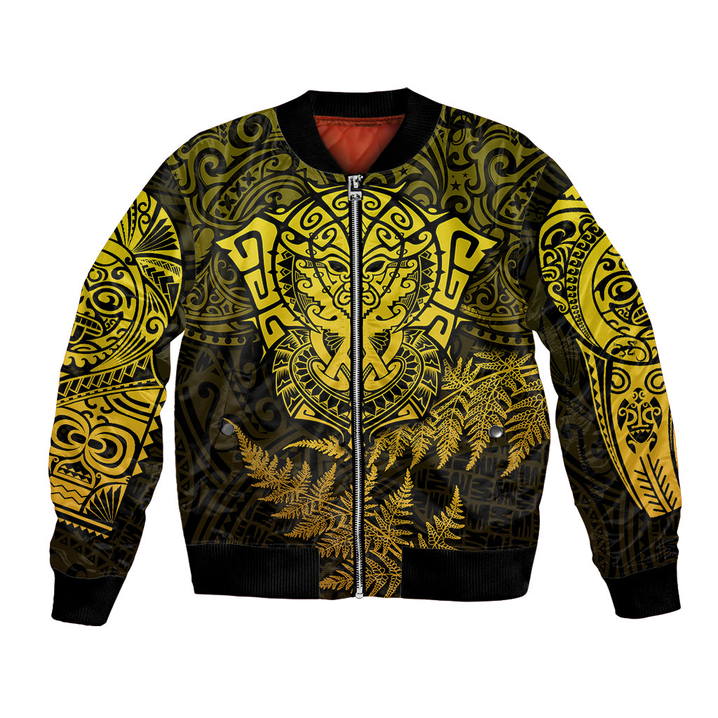 Unisex bomber jacket in gold and black with zip front and Maori-style graphic